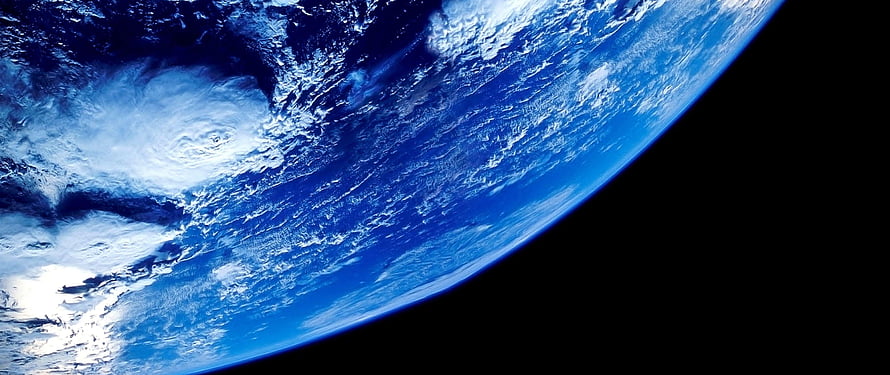 Earth From Space: Blue Planet Horizon With Swirling Clouds Against Black Void HD wallpaper