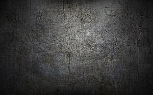 Dark scratched iron metal surface with industrial grunge texture and subtle lighting HD wallpaper