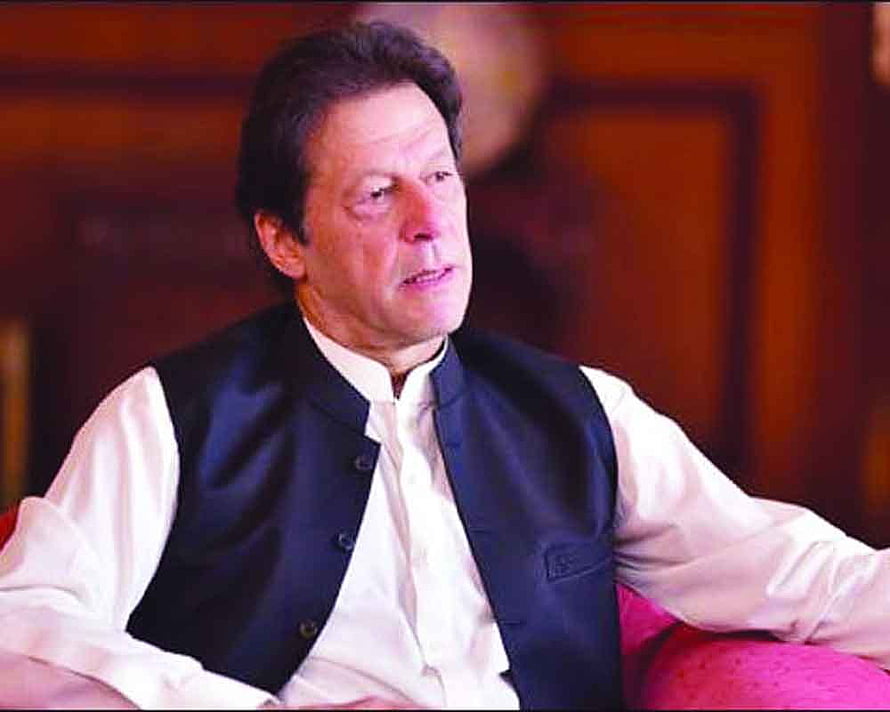 Imran Khan in a white shirt and dark vest seated in a formal indoor setting HD wallpaper