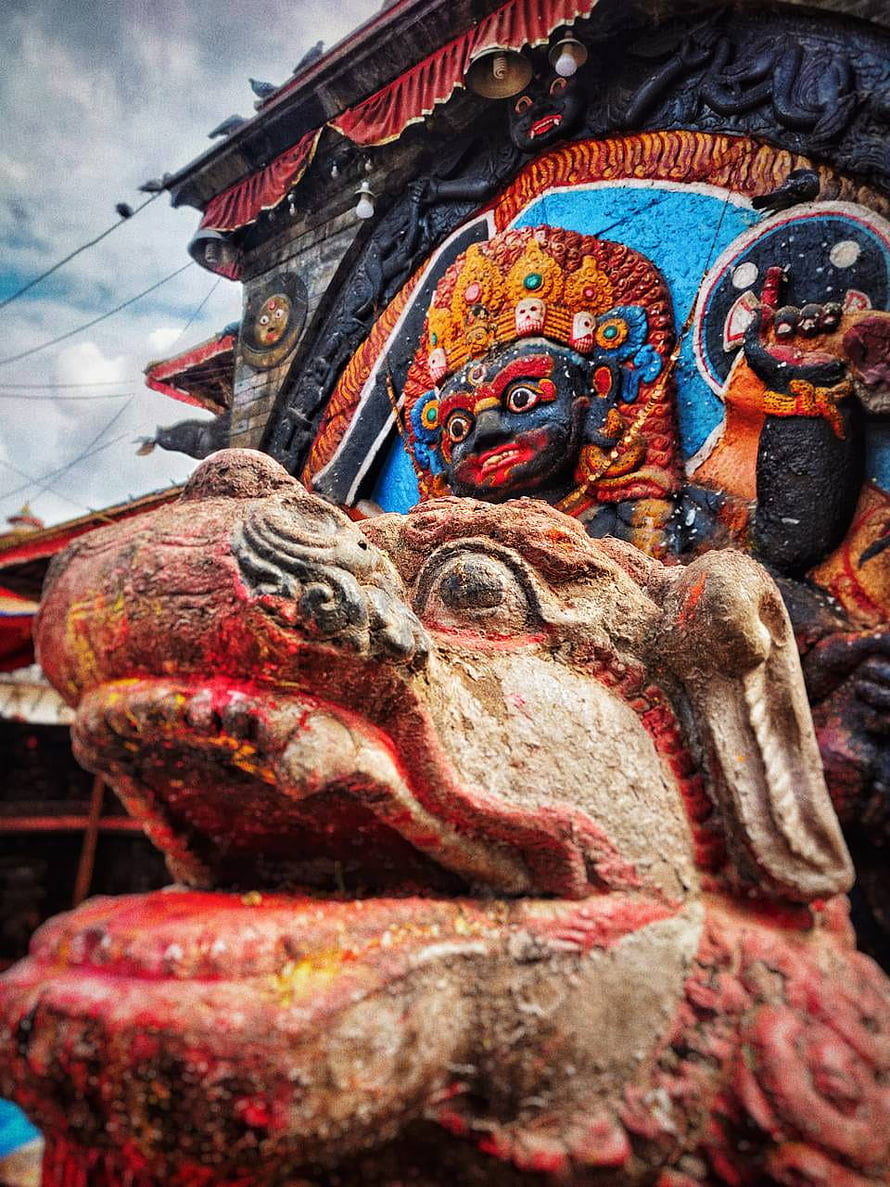 Kaal Bhairav Temple Sculpture with Intricate Carvings and Vibrant Colors HD phone wallpaper