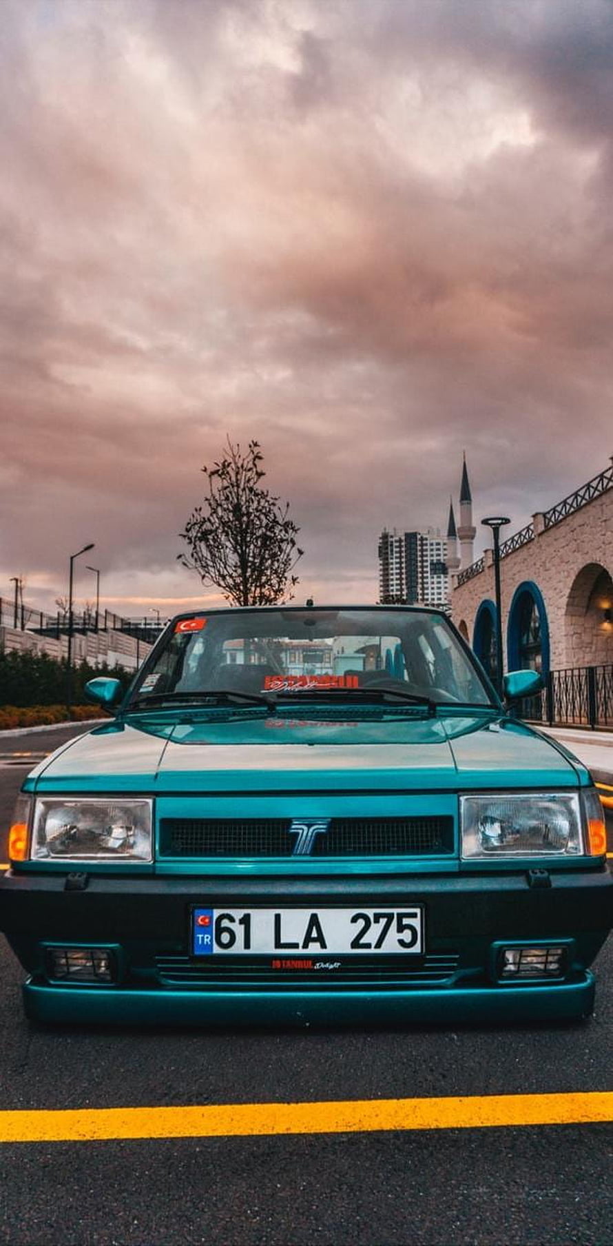 Turquoise Tofas Dogan SLX Front View Under Dramatic Sunset Sky HD phone wallpaper