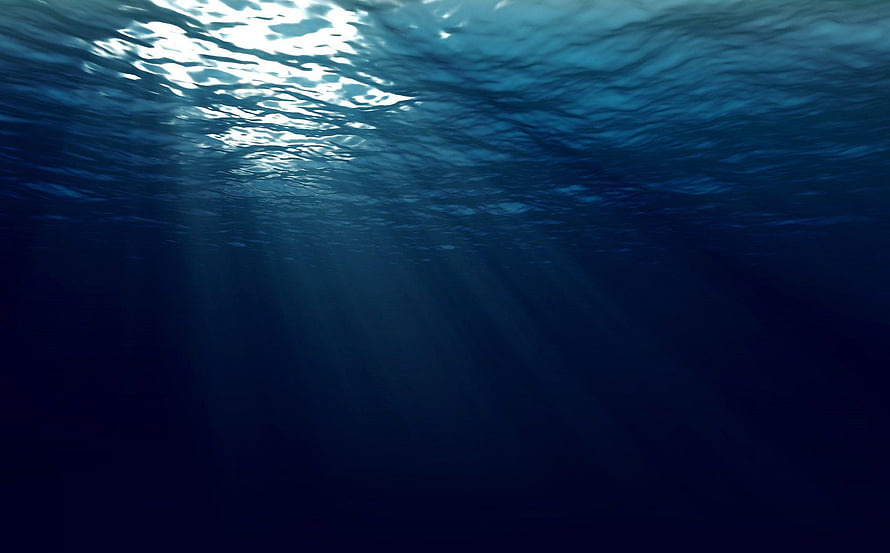 Sunlight Rays Piercing Through Deep Ocean Water Surface HD wallpaper