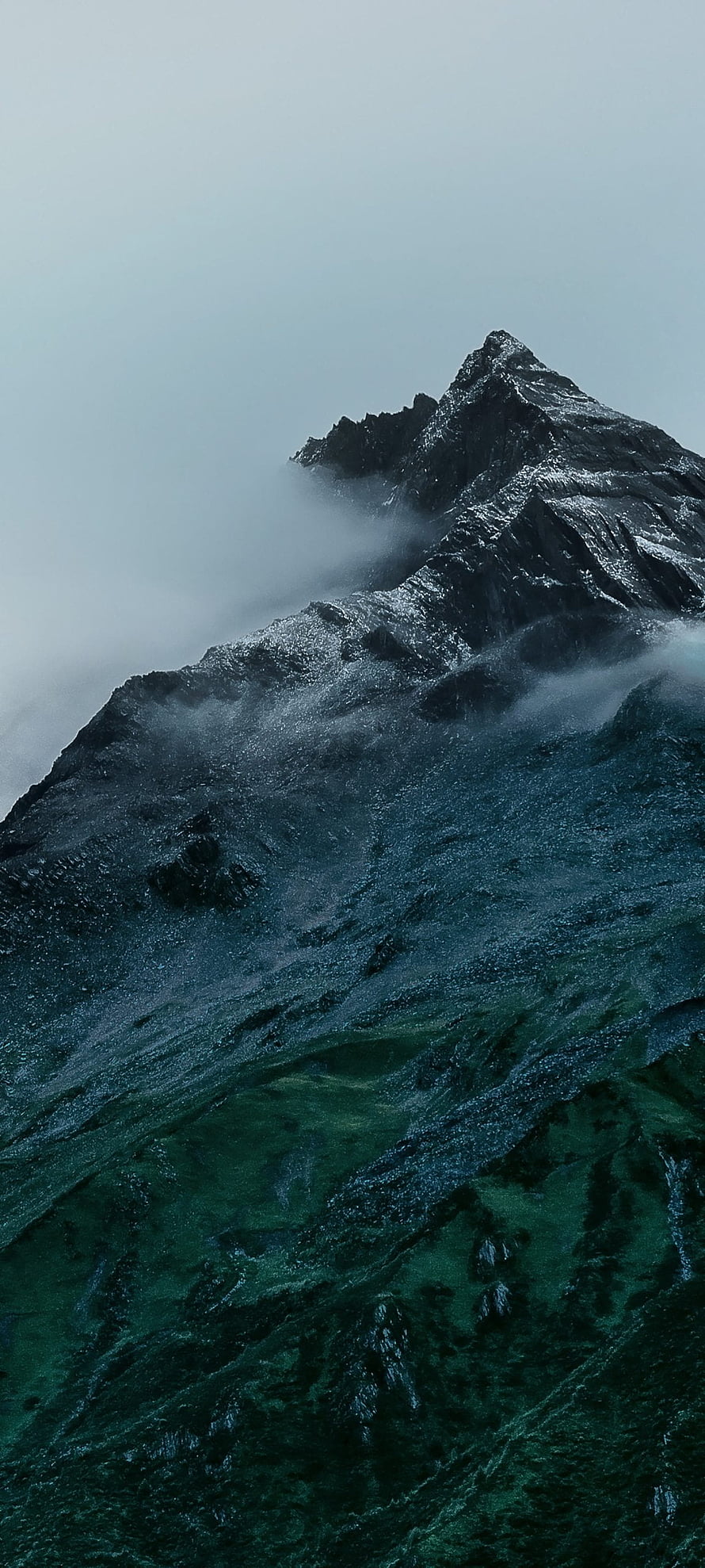 Misty Mountain Peak with Dark Rugged Slopes and Green Valleys HD phone wallpaper