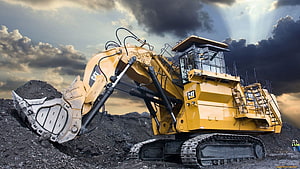 Caterpillar Mining Excavator Digging Coal Under Dramatic Stormy Sky HD wallpaper