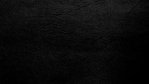 Dark Black Leather Texture Surface with Subtle Grain and Wrinkles HD wallpaper