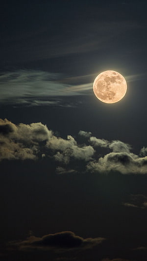 Full Moon Rising Over Dark Clouds in a Night Sky HD phone wallpaper