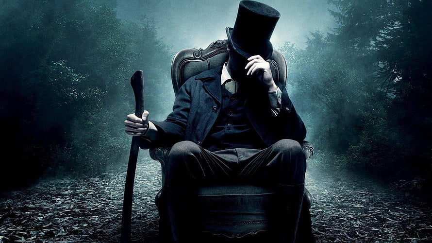 Victorian Gentleman in Top Hat Seated in Misty Forest HD wallpaper