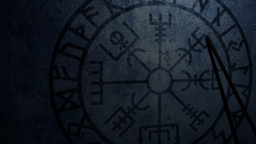 Ancient Norse Rune Circle Carved in Dark Stone with Shadowy Atmosphere HD wallpaper