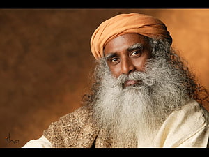 Sadhguru Portrait in Orange Turban and White Robes HD wallpaper