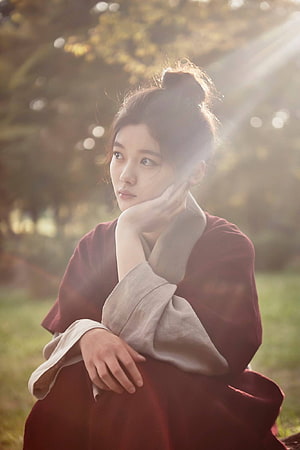 Kim Yoo Jung in Traditional Hanbok with Golden Hour Backlight in a Forest HD phone wallpaper