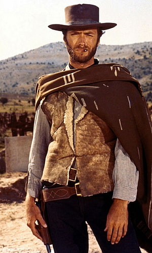 Clint Eastwood in Western Cowboy Attire with Poncho and Hat HD phone wallpaper