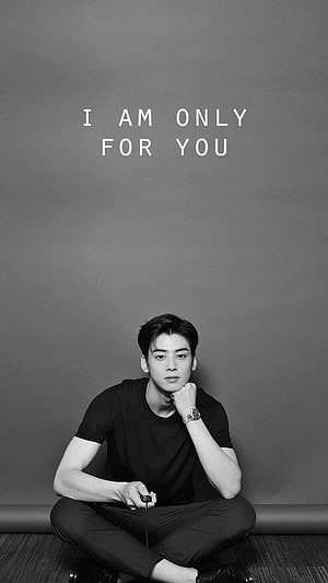 Cha Eun Woo Black and White Portrait Sitting Cross-Legged with Minimalist Text Overlay HD phone wallpaper