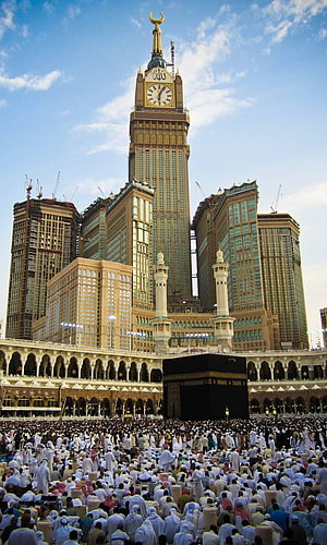 Grand Mosque in Mecca with Kaaba and Makkah Clock Tower surrounded by pilgrims HD phone wallpaper