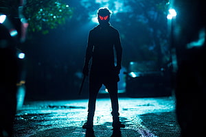 Bhavesh Joshi Superhero Silhouette with Glowing Red Eyes on Rainy Night Street HD wallpaper