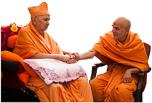 Pramukh Swami Maharaj and Mahant Swami Maharaj in a moment of spiritual connection HD wallpaper