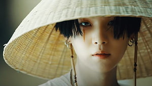 Suga from BTS in a traditional conical hat with dark hair and subtle facial markings HD wallpaper