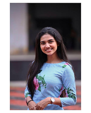 Mamitha Baiju smiling portrait in floral striped dress HD phone wallpaper