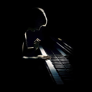 Woman Playing Grand Piano in Dramatic Low-Key Lighting HD phone wallpaper
