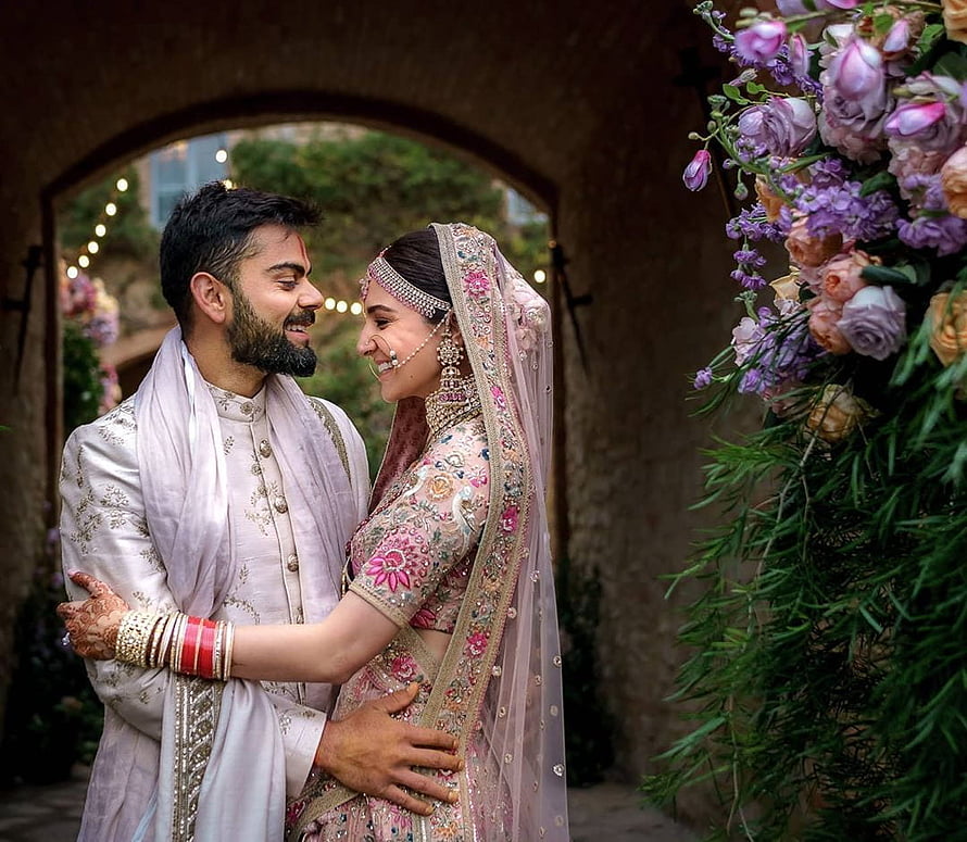 Virat Kohli and Anushka Sharma in traditional Indian wedding attire at their Tuscany ceremony HD wallpaper