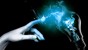 Electric Spark Between Finger and Light Bulb on Black Background HD wallpaper