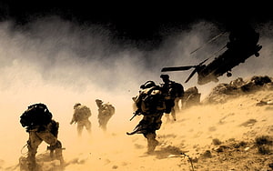 Indian Army soldiers advancing through dusty terrain with military helicopter HD wallpaper