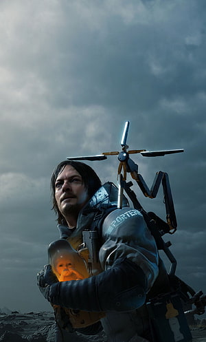 Sam Porter Bridges Carrying Baby Pod in Death Stranding Post-Apocalyptic Landscape HD phone wallpaper