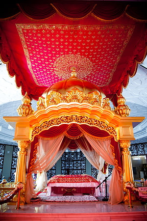 Ornate Golden Palki and Red Canopy Inside a Gurudwara HD phone wallpaper