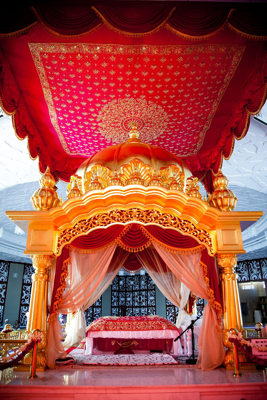 Ornate Golden Palki and Red Canopy Inside a Gurudwara HD phone wallpaper