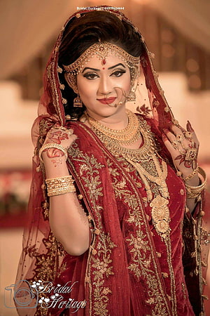 Elegant Indian Bride in Traditional Red Lehenga with Gold Jewelry and Henna HD phone wallpaper