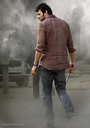 Prabhas in Mirchi 2 Action Still with Knife and Smoke HD phone wallpaper