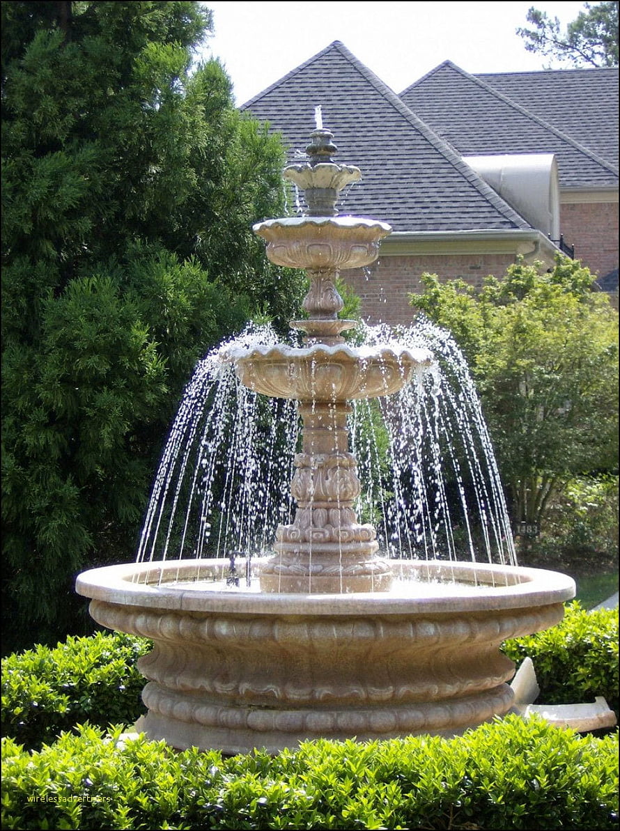 Ornate Three-Tier Garden Water Fountain with Flowing Water Jets in a Lush Green Landscape HD phone wallpaper