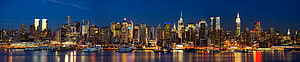 New York City Manhattan Skyline at Night with Waterfront Reflections HD wallpaper