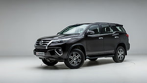 Black Toyota Fortuner SUV Studio Shot with Chrome Accents and Alloy Wheels HD wallpaper
