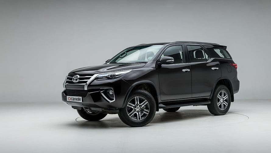 Black Toyota Fortuner SUV Studio Shot with Chrome Accents and Alloy Wheels HD wallpaper