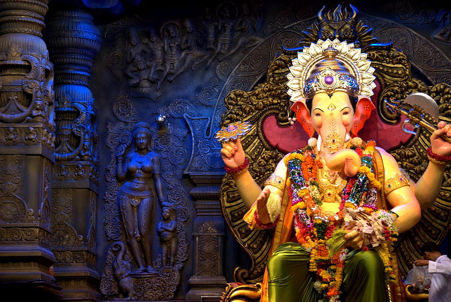 Ornate Ganesha Murti Adorned With Marigold Garlands In A Mumbai Temple HD wallpaper