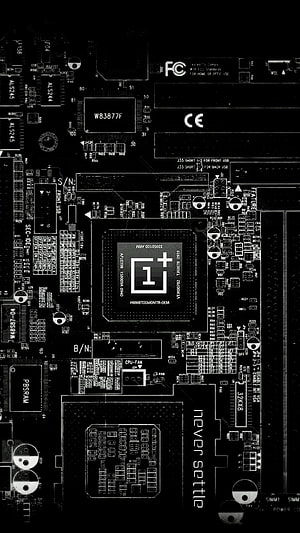 OnePlus motherboard circuit board with processor chip and never settle branding HD phone wallpaper