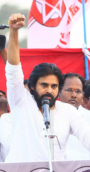 Pawan Kalyan Raising Fist at Political Rally with Microphone and Party Flag HD phone wallpaper