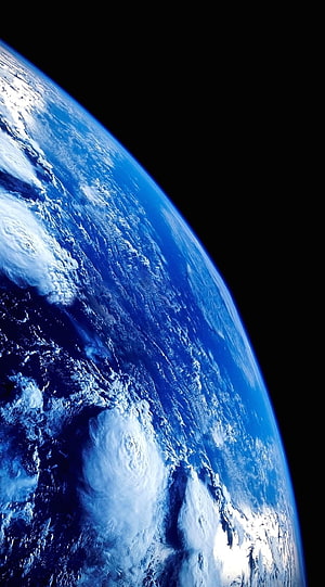Earth From Space: Blue Planet Horizon With Swirling Clouds Against Black Void HD phone wallpaper