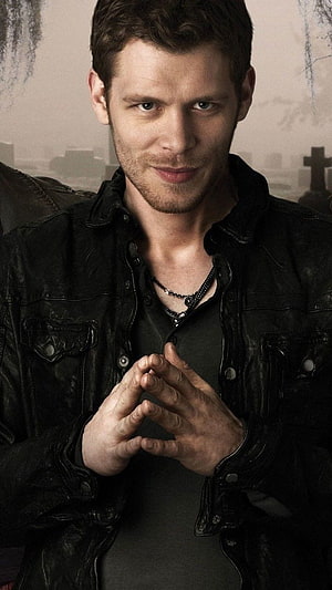 Klaus Mikaelson in Black Leather Jacket with Cemetery Backdrop HD phone wallpaper
