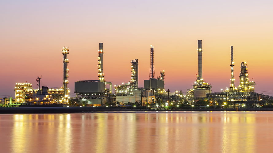Illuminated Oil Refinery Complex at Dusk with Water Reflections HD wallpaper