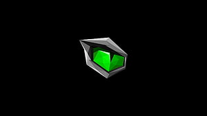 Low Poly Green Crystal Gemstone with Metallic Frame on Black Background HD wallpaper
