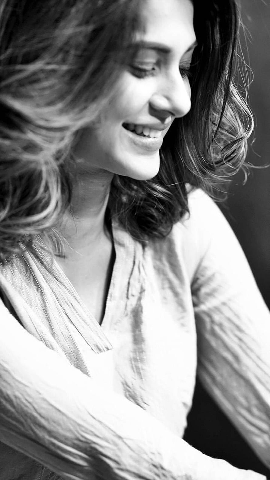 Jennifer Winget Black and White Portrait with Windblown Hair and Gentle Smile HD phone wallpaper