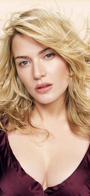 Kate Winslet Close-Up Portrait with Windblown Blonde Hair and Burgundy Top HD phone wallpaper