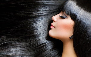 Elegant Woman Profile With Flowing Black Hair And Dramatic Makeup HD wallpaper