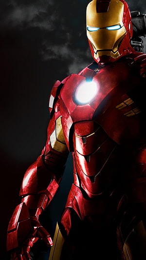 Iron Man Mark VII Armor Close-Up with Glowing Arc Reactor and Blue Eyes HD phone wallpaper