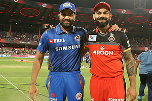 Virat Kohli and Rohit Sharma in IPL 2019 team kits on the cricket field HD wallpaper