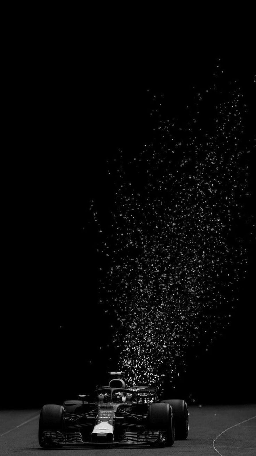 Formula 1 Race Car Emitting Sparks on Dark Track at Night HD phone wallpaper