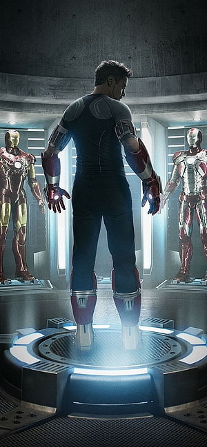 Iron Man in the Hall of Armor with Mark 1 and Mark 2 Suits HD phone wallpaper
