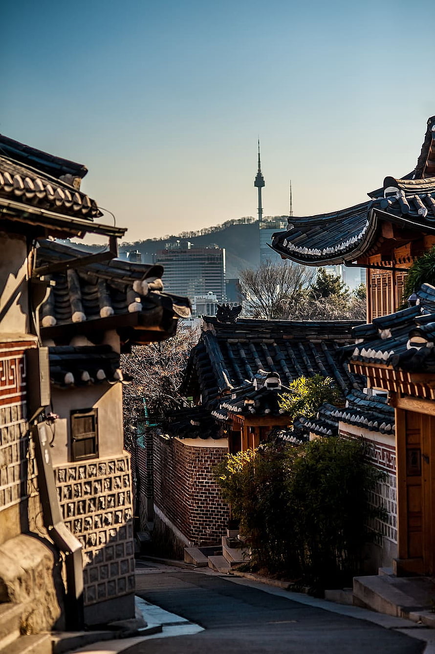 Bukchon Hanok Village in Seoul with N Seoul Tower in the Distance HD phone wallpaper