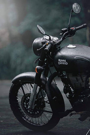 Black Royal Enfield Classic Motorcycle in Rainy Atmosphere HD phone wallpaper